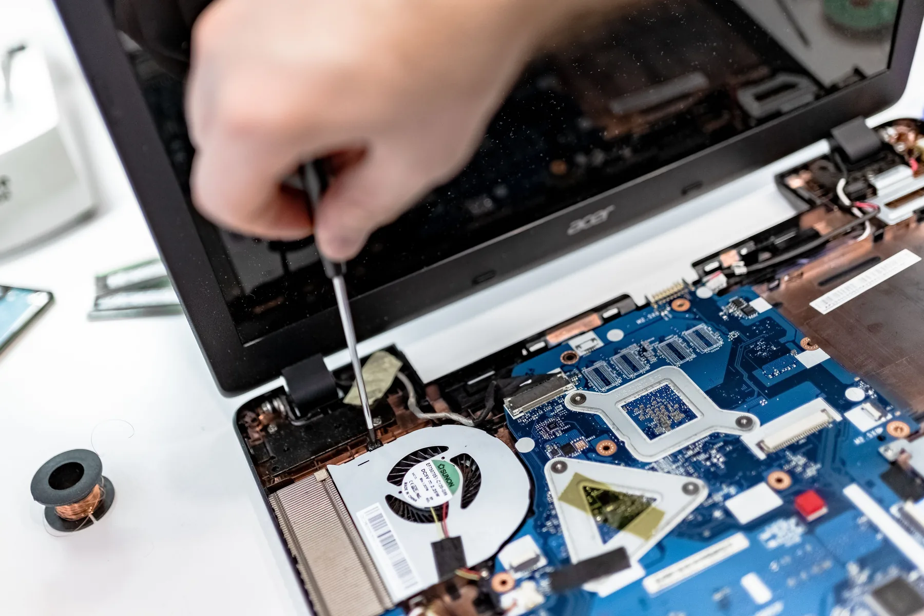Laptop motherboard being repaired